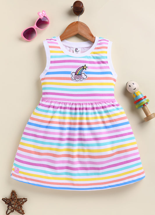 Flat lay of an Annie brand girls sleeveless frock featuring pastel multi-colored horizontal stripes in pink purple blue yellow and peach on a white background and an embroidered rainbow and cloud patch reading GIRL on the chest.