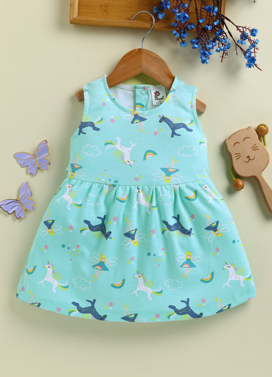 Flat lay of an Annie brand girls sleeveless pink frock featuring a gently gathered waist and an all-over magical print with white and blue unicorns, fairies, rainbows, clouds, and stars.