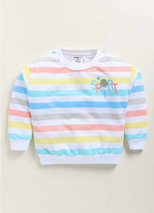 showing a flat lay of a Biskid brand girls long-sleeve pullover top. The top features horizontal stripes in pastel blue, yellow, peach, and grey on a white base, with a "SPORT" graphic featuring a tennis racket on the upper chest, and white ribbed trim at the neck, cuffs, and hem.