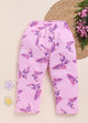 Image file 1512-Pink.jpg showing a pair of Biskid brand girls' pink long pants with an all-over butterfly and floral print, displayed with two star-shaped decorations and a cluster of pink flowers on a woven mat.