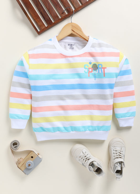 showing a flat lay of a Biskid brand girls long-sleeve pullover top. The top features horizontal stripes in pastel blue, yellow, peach, and grey on a white base, with a "SPORT" graphic featuring a tennis racket on the upper chest, and white ribbed trim at the neck, cuffs, and hem.