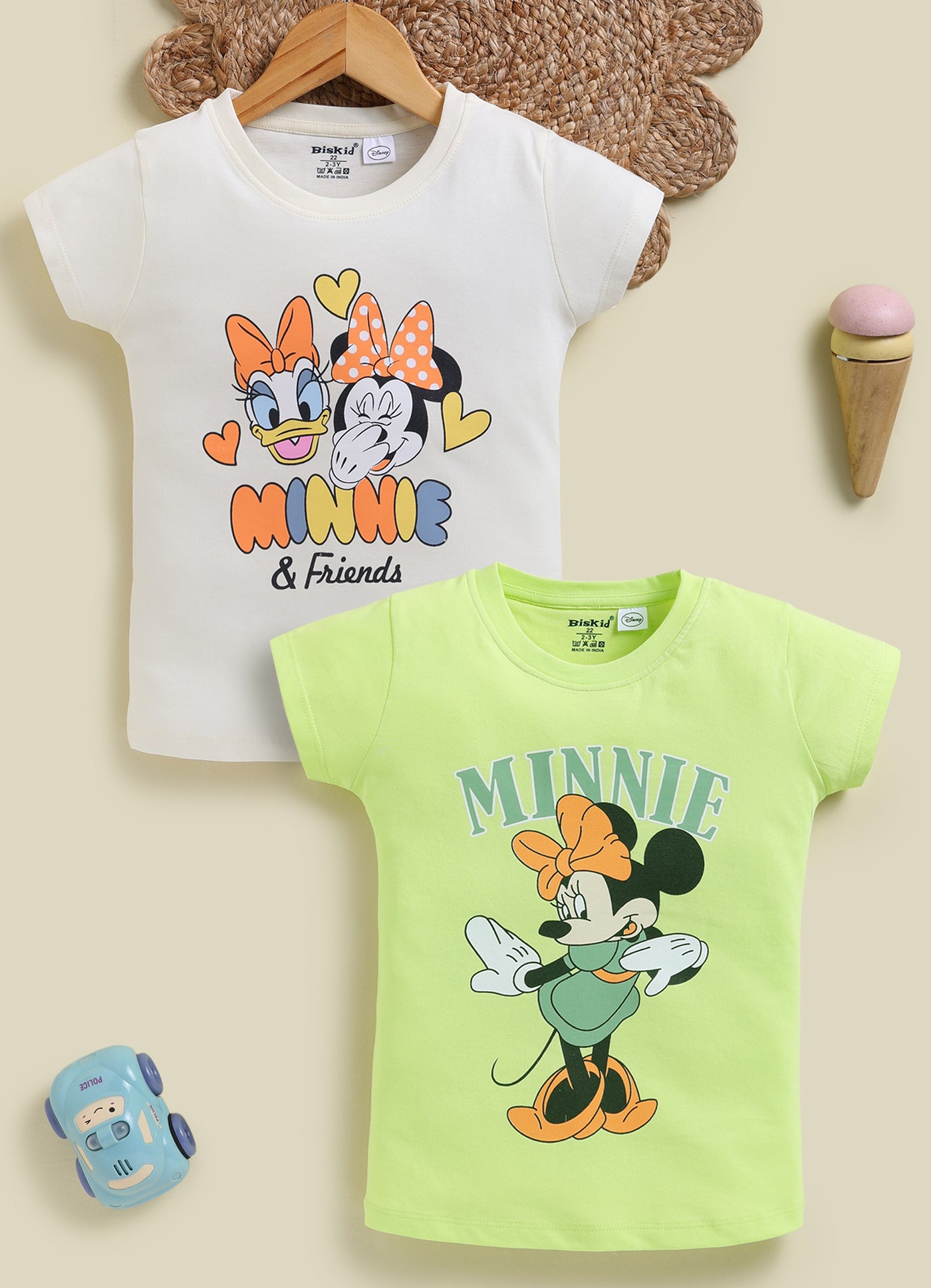 Image file 1819-L.Grn--1819-Crm.jpg showing a 2-pack of Biskid girls short-sleeve tops featuring Disney prints, including a cream top with Daisy Duck and Minnie Mouse and a light green top with a Minnie Mouse graphic.
