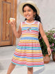 Flat lay of an Annie brand girls sleeveless frock featuring multi-colored horizontal rainbow stripes on a white background and an embroidered rainbow and cloud patch reading GIRL on the chest.