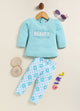Image file BG-415-SkyBlue.jpg showing a flat lay of an Annie brand girls two-piece clothing set. The outfit includes a textured sky-blue long-sleeve top with the word "BEAUTY" and floral accents, paired with matching leggings featuring a light blue and white checkerboard pattern decorated with simple flowers.