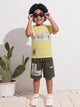 Image file 10407-Lemon.jpg showing a flat lay of a Unokids brand boys two-piece clothing set featuring a textured lemon yellow short-sleeve t-shirt with urban typographic graphics and dark olive green cargo shorts with an elastic drawstring waist and multiple functional pockets.