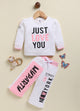 Annie white and pink sporty clothing set for girls featuring a long-sleeve sweatshirt with a "Just Love You" graphic and matching jogger pants with color-blocked details and text prints.