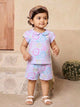 Annie brand girls two-piece clothing set featuring a sky blue short-sleeve top with a Peter Pan collar and matching shorts. Both pieces feature an all-over pastel print of doodle smiley faces, hearts, and the word HELLO in pink, blue, and yellow. The shorts have an elastic drawstring waist and front pockets.