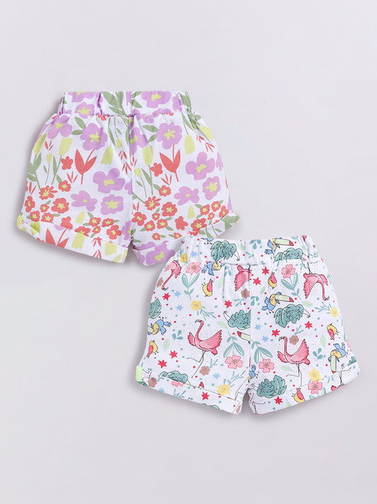 Image file Front combo_2.jpg showing a 2-piece set of Biskid brand girls' casual shorts; one pair features a colorful pastel floral print, and the other features a tropical-themed print with flamingos, toucans, and plants on a white background, both with cuffed hems and drawstring waists.