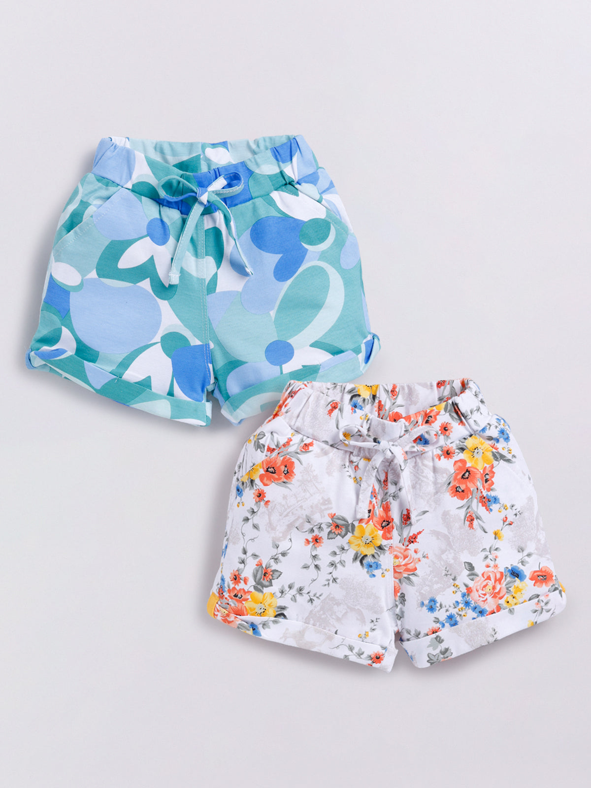 Image file Front combo.jpg showing a 2-piece set of Biskid brand girls' casual shorts; one pair features a bold blue-and-green abstract floral print, and the other features a delicate multi-colored floral print on a white background, both with cuffed hems and drawstring waists.