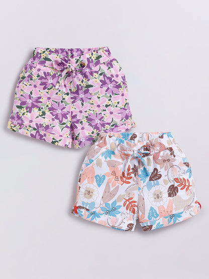 Image file Front combo_3.jpg showing a 2-piece set of Biskid brand girls' casual shorts; one pair features a vibrant purple-toned floral print, and the other features a whimsical animal and leaf print on a white background, both with cuffed hems and drawstring waists.