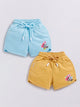 Image file Front combo_5.jpg showing a 2-piece set of Biskid brand girls' casual shorts; one pair is sky blue and the other is mustard yellow, both featuring Minnie Mouse graphics, drawstring waists, and "BISKID" branding on the side pocket.