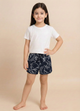 Image file 1409-Black.jpg showing a pair of Biskid brand black shorts with an elastic drawstring waistband, covered in a bold white abstract floral line-art print, and featuring a small "BISKID" brand tag on the side.