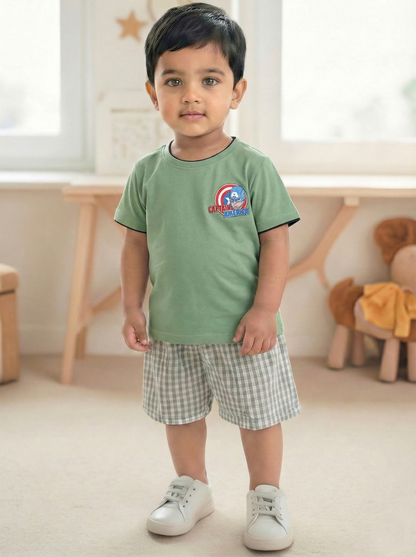 Image file _MG_5127 Colour Correction (4).jpg showing a flat lay of an olive green Biskid brand boys short-sleeve t-shirt featuring a Captain America graphic, his shield logo, and contrasting black and red neck trim.