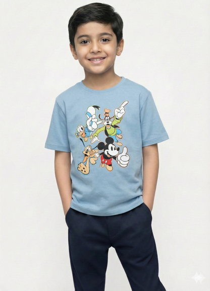 smiling young boy with dark hair modeling a light blue Biskid brand short-sleeve t-shirt. The shirt features a colorful graphic of classic Disney characters including Mickey Mouse, Donald Duck, Goofy, and Pluto in playful poses.