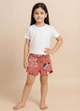 Image file 1409-Peach.jpg showing a pair of Biskid brand peach girls shorts with an elastic drawstring waistband, covered in an all-over beach-themed typography print featuring words like "SWEET" and "COMFORT," with a small "BISKID" brand tag on the side.