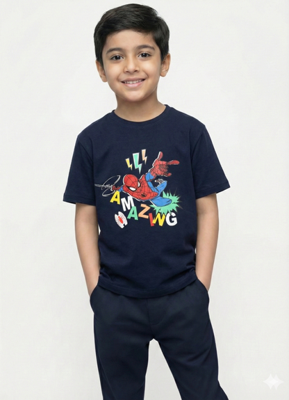 showing a smiling young boy with dark hair modeling a navy blue Biskid brand short-sleeve t-shirt. The shirt features an action graphic of Spider-Man leaping, surrounded by lightning bolts, a white spider symbol, and the word "AMAZING" in scattered, colorful block letters.