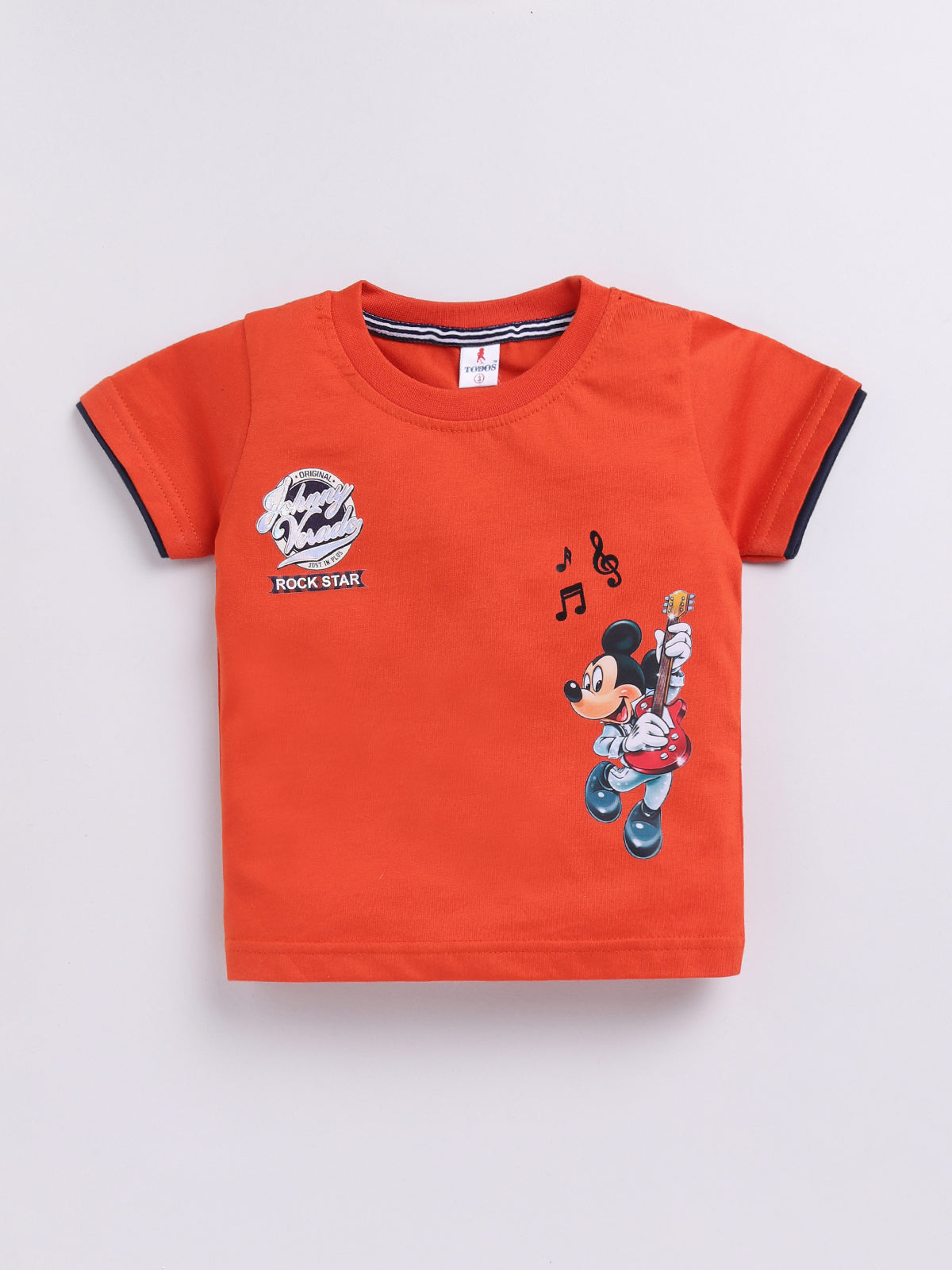 showing a flat lay of a Todos brand boys two-piece clothing set. The outfit features a bright orange short-sleeve t-shirt with a graphic of Mickey Mouse playing a guitar and "ROCK STAR" text, paired with dark wash denim shorts featuring an elastic waistband, an orange drawstring, front pockets, and a "ROCKSTAR" patch on the left leg.
