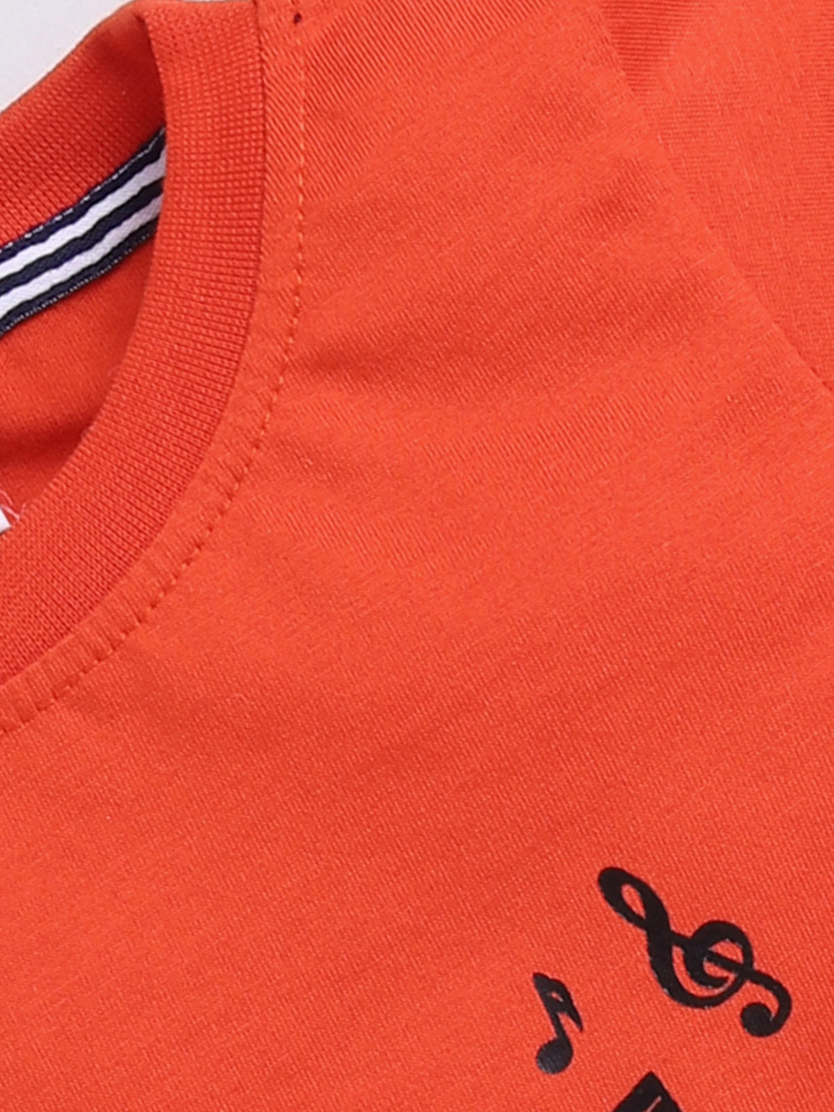 showing a flat lay of a Todos brand boys two-piece clothing set. The outfit features a bright orange short-sleeve t-shirt with a graphic of Mickey Mouse playing a guitar and "ROCK STAR" text, paired with dark wash denim shorts featuring an elastic waistband, an orange drawstring, front pockets, and a "ROCKSTAR" patch on the left leg.