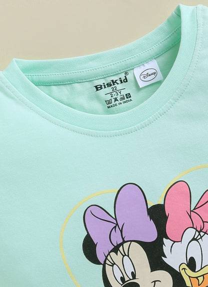 Image file 1819-Pch--1819-Lm.Grn.jpg showing a 2-pack of Biskid girls short-sleeve tops featuring Disney prints, including a peach Minnie Mouse top and a mint green "Best Friends Forever" Minnie and Daisy top.