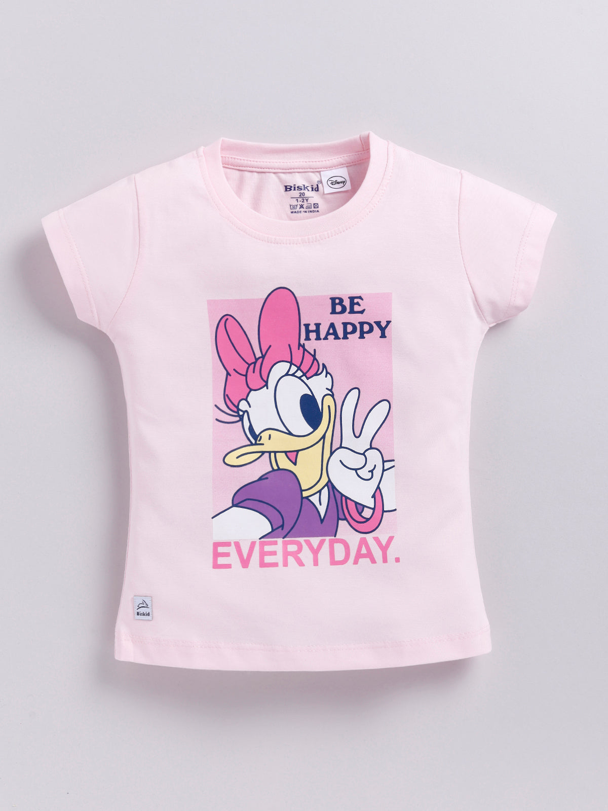 Image file _MG_5190.jpg showing a flat lay of a light pink Biskid brand girls short-sleeve t-shirt featuring a graphic of Daisy Duck and the text "BE HAPPY EVERYDAY."
