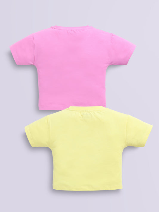 Image file d.pink_lemon.jpg showing a 2-pack of Biskid girls short-sleeve casual crop tops featuring embossed typographic prints, including a dark pink "DREAMS NEW YORK" top and a lemon yellow "GAME ON" top.