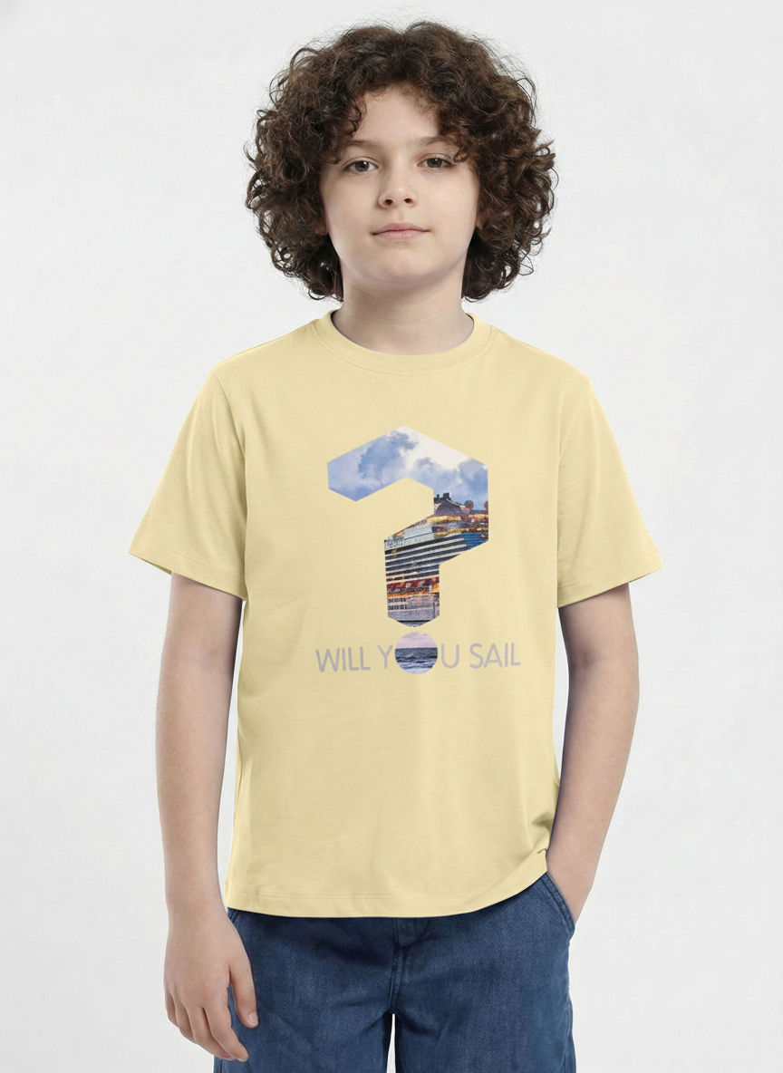 showing a young boy with curly hair modeling a Biskid brand pastel yellow short-sleeve t-shirt. The shirt features a large question mark graphic filled with a photo of a cruise ship, with the dot of the question mark acting as the letter "O" in the text "WILL YOU SAIL" printed below.