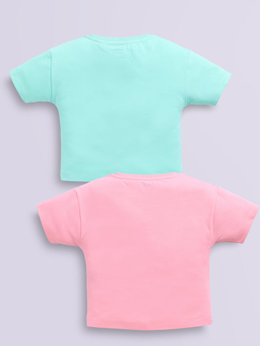Image file lt.peach_scagreen.jpg showing a 2-pack of Biskid girls short-sleeve casual crop tops featuring embossed typographic prints, including a light peach "GOOD VIBE 1998" top and a sea green "DREAMS NEW YORK" top.
