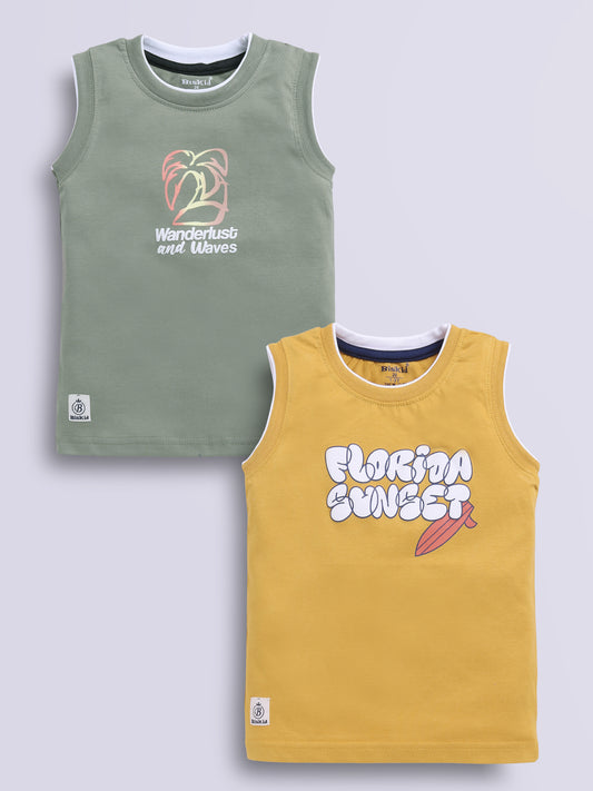 Image file musterd_d_green.jpg showing a 2-pack of Biskid boys sleeveless vests/tank tops featuring graphic prints, including an olive green vest with "Wanderlust and Waves" graphics and a mustard yellow vest with "FLORIDA SUNSET" typography.