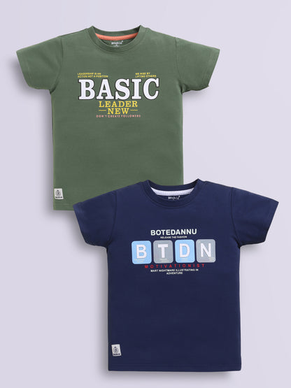 Image file navy_m.green.jpg showing a 2-pack of Biskid boys short-sleeve t-shirts featuring typographic prints, including a green tee with "BASIC LEADER" lettering and a navy blue tee with "BTDN" block letter graphics.