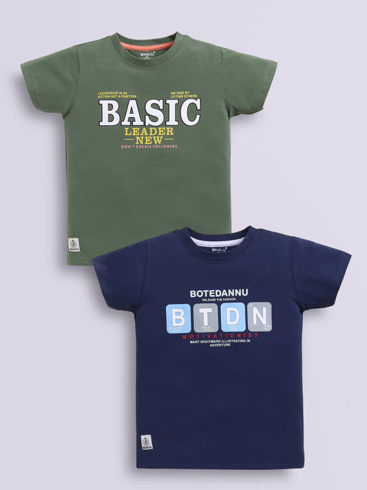 Image file navy_m.green.jpg showing a 2-pack of Biskid boys short-sleeve t-shirts featuring typographic prints, including a green tee with "BASIC LEADER" lettering and a navy blue tee with "BTDN" block letter graphics.