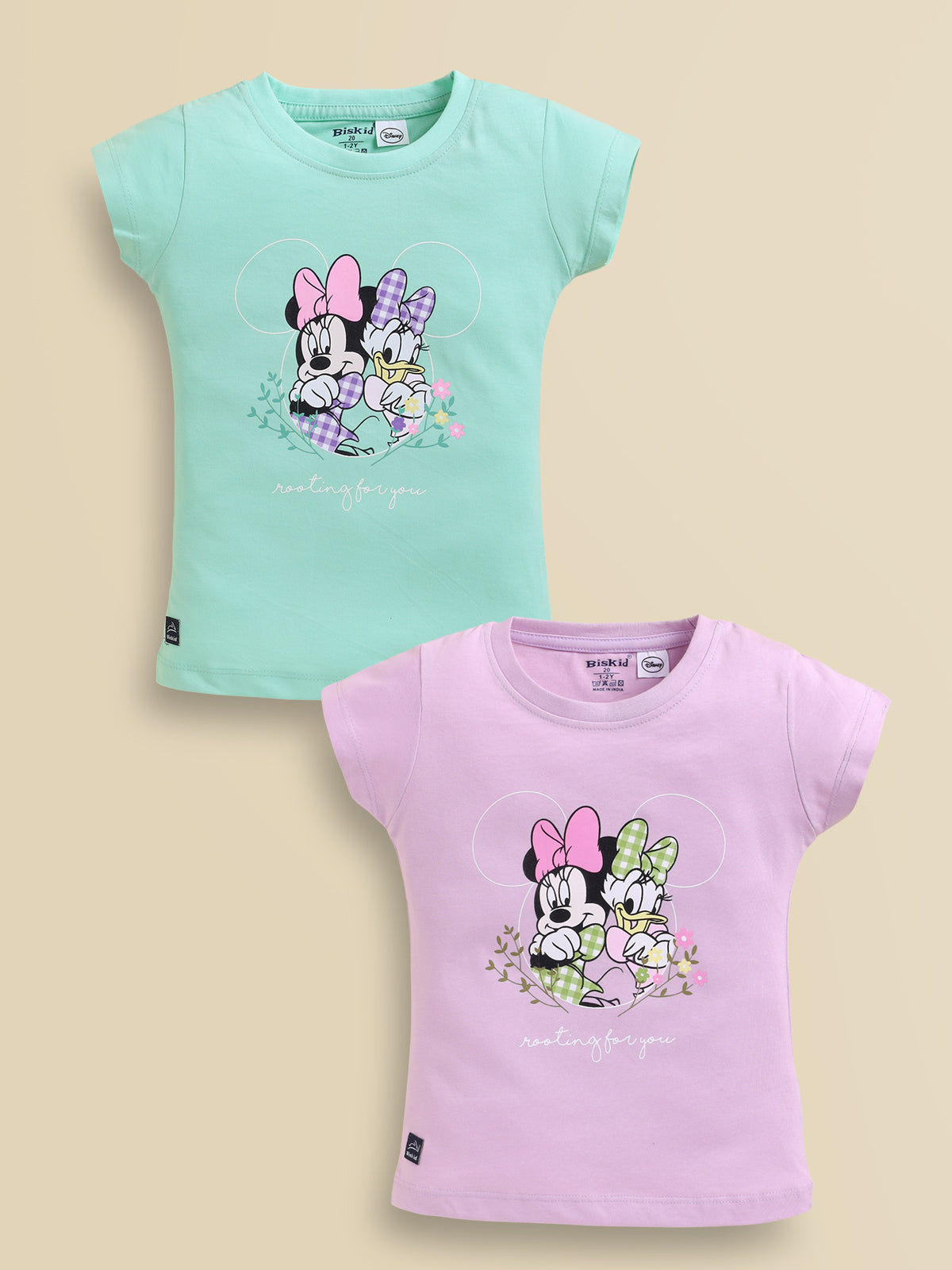 Image file showing a 2-pack of Biskid girls short-sleeve tops featuring Disney prints, including a mint green top and a lavender top both with a Minnie Mouse and Daisy Duck "rooting for you" graphic.