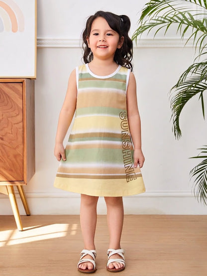 Annie brand girls sleeveless A-line frock. The dress features horizontal stripes in earthy tones of beige, green, pale yellow, and brown, white trim around the neck and armholes, a back snap closure, and the word "SUNSHINE" printed vertically near the bottom hem.