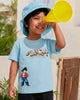 Image file 871-MintGreen.jpg showing a Biskid brand boys' mint green crew neck t-shirt with an "AKIRA TORIYAMA" graphic and character print on the front, displayed on a wooden hanger with a wooden toy figurine and a small dog toy nearby.